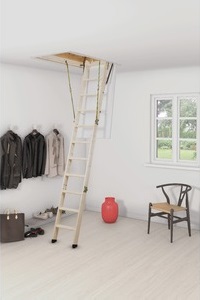 a man using a wooden loft ladder